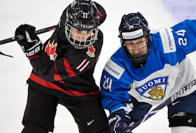 Canada’s Jill Saulnier, left, battles Finland’s Noora Tulus during semifinal action at the 2019 world women’s hockey championship in Espoo, Finland. On Saturday, her  28th birthday, Saulnier learned of the news that this year's worlds to be held in Halifax and Truro had been cancelled.