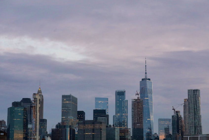 The skyline of lower Manhattan is seen before sunrise in New York City. REUTERS/Brendan McDermid/File Photo