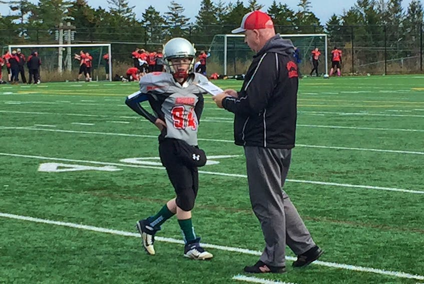 Fall River football coach Ian Avery talks to a player on the sidelines during a recent peewee game. An eligibility issue in the pee wee division has parents, coaches and administrators upset with other clubs, with each other and with the governing body, Football Nova Scotia. 
Bill Spurr - The Chronicle Herald