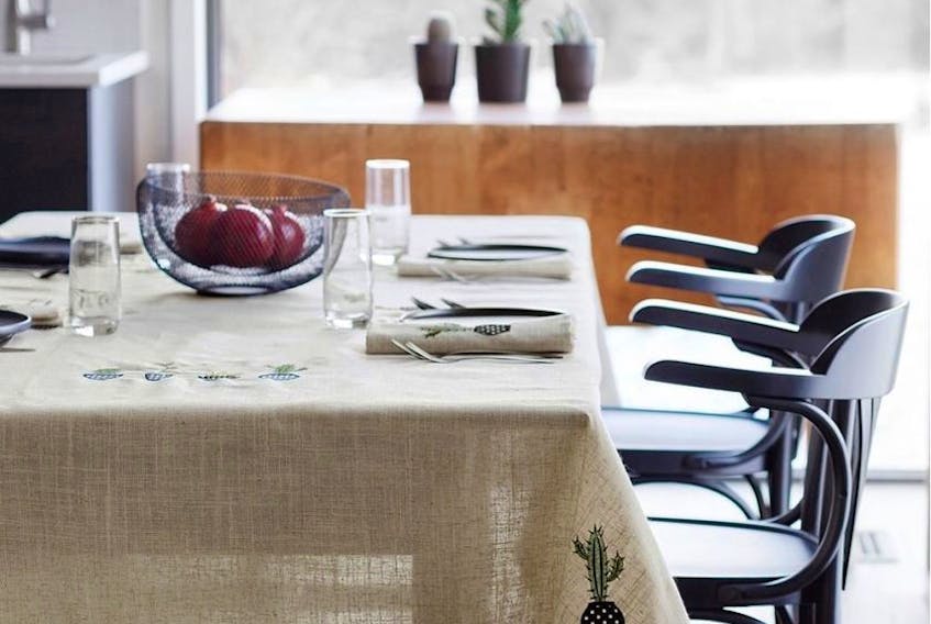 The new kitchen makes room for the family table and is a great way to create a meeting hub in the home. Embroidered Cactus Tablecloth, Simons Maison.