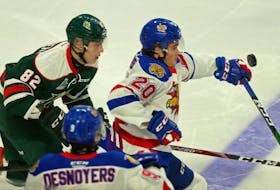 Halifax Mooseheads winger Senna Peeters, left, and Moncton Wildcats defenceman Axel Andersson track the puck during a QMJHL game at the Scotiabank Centre. (TIM KROCHAK/Chronicle Herald)