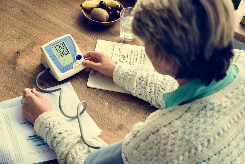 A woman measure her blood pressure in this stock photo. Lisa Williams, the president and CEO of Unicare Home Health Care and Uniclean Solutions in Miramichi, N.B., this week launched WellCheck, an app that shows patterns in health status and aims to prevent a crisis.
Rawpixel Ltd.