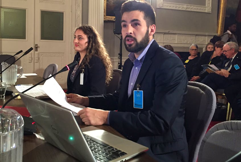 East Coast Prison Justice members Hanna Garson and Harry Critchley present their concerns about a proposed committee to review deaths of children in the care of the province to the law amendments committee at Province House last week. ANDREW