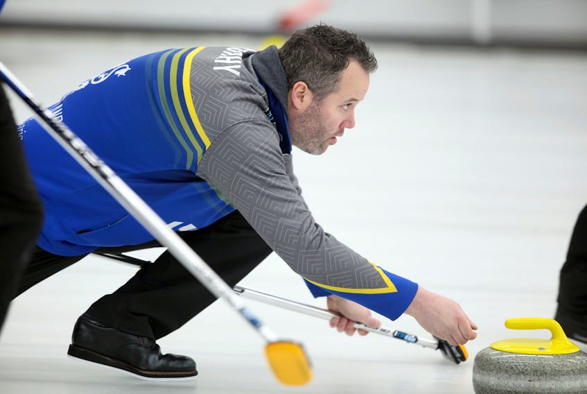 Skip Jamie Murphy releases his first rock during the sixth end on the opening day of the  Nova Scotia Deloitte Tankard men’s curling championships at the Dartmouth Curling Club.
ERIC WYNNE/Chronicle Herald