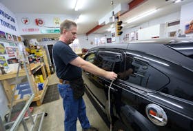 Jan. 21, 2021--Derek Goldsmith measures the width of a window for a car to be tinted in his shop in Lawrencetown, NS, Thursday.
(for Lambie story on tinting of car windows)
ERIC WYNNE/Chronicle Herald