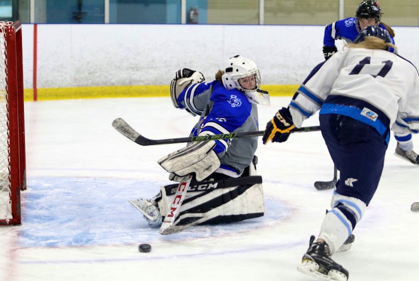 Feb. 2, 2021--Lockview Dragons' Kaitlyn Langille makes a pad save as she reads the play as C.P. Allen attacks late in the second period at the BMO Centre Monday.
ERIC WYNNE/Chronicle Herald