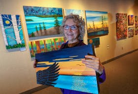 Halifax artist Shelagh Duffett displays one of her paintings in the WILD Exhibition at the Nova Scotia Public Archives’ Chase Gallery. Opening Saturday with a reception from noon to 4 p.m., the collection of work by 10 artists is raising money for the Nova Scotia Nature Trust’s campaign to preserve the Blue Mountain Wilderness Connector running between Hammonds Plains and Hubley. - ERIC WYNNE/The Chronicle Herald