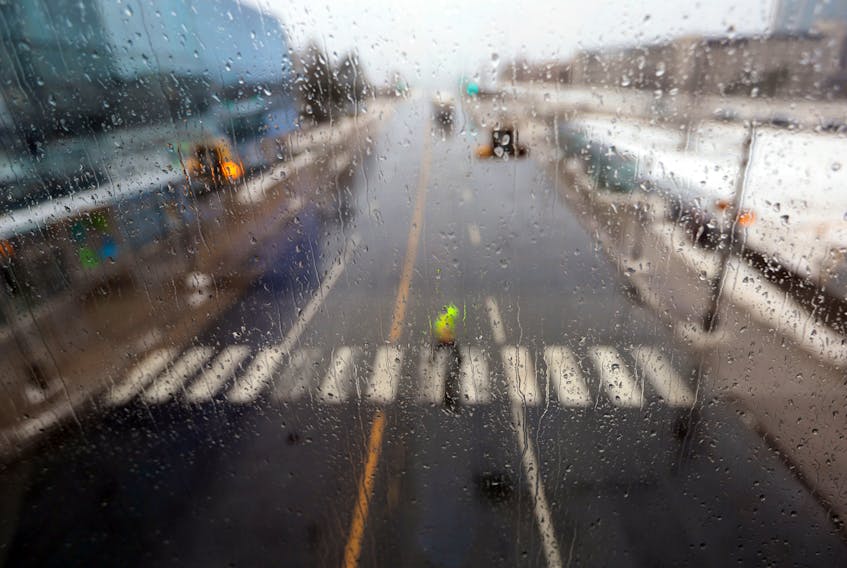 Feb. 16, 2021--From the perspective of the pedway a pedestrian  walks along the crosswalk on Barrington Street Tuesday.
ERIC WYNNE/Chronicle Herald