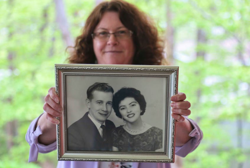 Renee Field shows a photo of her parents when they married in 1965. Field’s mother, 77, is currently in Northwood. She was diagnosed with COVID-19, but has since recovered.