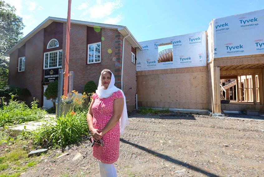 Manvinder Kaur Dhillon, treasurer of the Maritime Sikh Society, in front of the cultural organization's gurdwara, or place of worship and assembly.