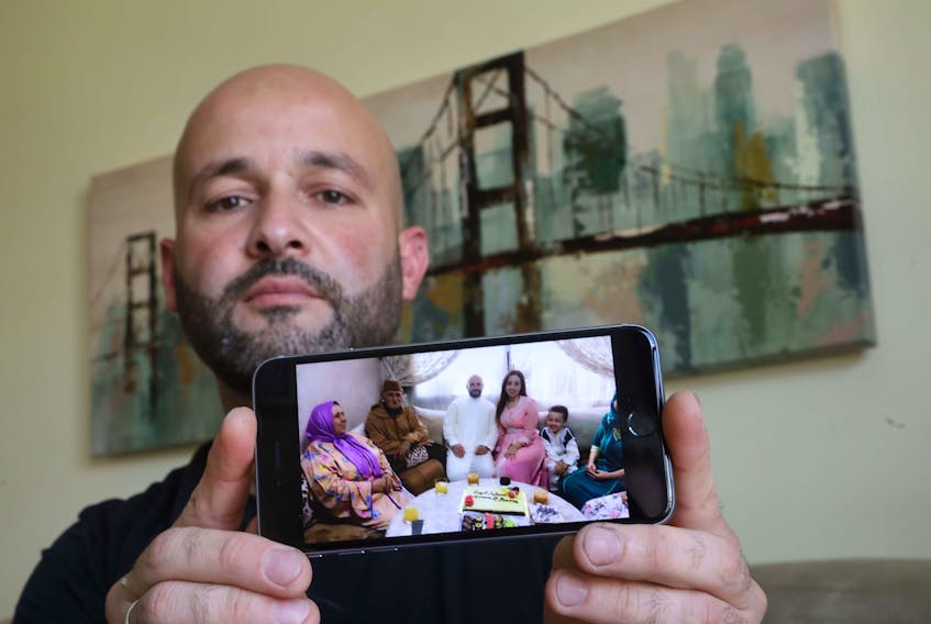 July 24, 2020—Baris Bayraktar shows a photo of his new wife and her family in Morocco after they were married in 2019. Bayraktar has been trying to sponsor his wife to come to Canada, but has been caught up in government red tape aggravated by delays due to COVID-19.