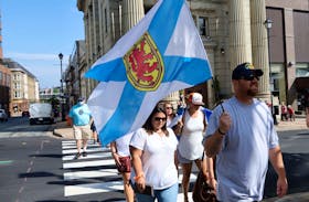 Nick Beaton, Kristen Beaton's husband, and the families of the Nova Scotia mass shooting in April hold a march of thanks Wednesday, July 29, 2020, after public inquiry called.