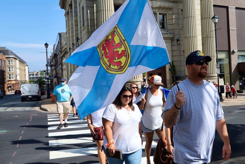 Nick Beaton, Kristen Beaton's husband, and the families of the Nova Scotia mass shooting in April hold a march of thanks Wednesday, July 29, 2020, after public inquiry called.