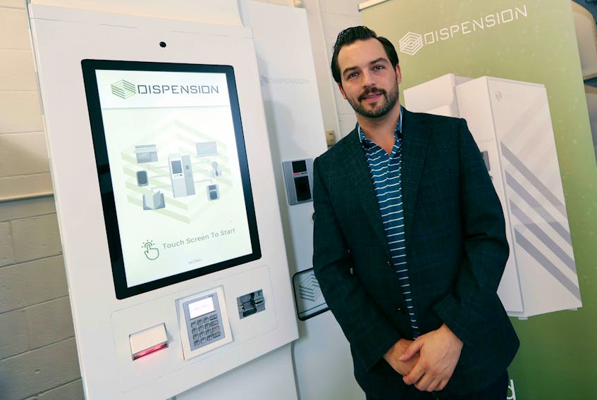 Corey Yantha, CEO of Dispension Industries in Burnside, stands beside a kiosk that dispenses controlled substances using palm-identification technology for safety and security.  ERIC WYNNE/Chronicle Herald