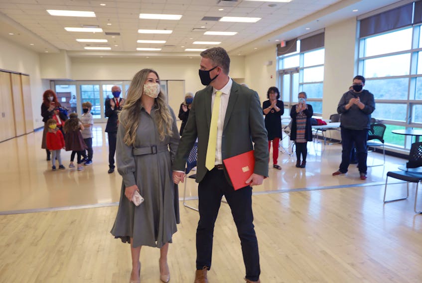 Iain Rankin and his wife Mary Chisholm walk into the room at the Prospect Road Community Centre on Monday, Oct. 5, 2020. He officially put his hat in the Liberal leadership race to replace outgoing leader Stephen McNeil.