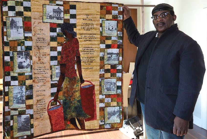 African-Nova Scotian art curator and historian David Woods displays a quilt titled Preston made by Laurel Francis, based on some of his own drawings. Woods’ ongoing efforts to celebrate and foster Black art through the Black Artists Network of Nova Scotia have recently recieved national attention through some leading Canadian arts publications. - ERIC WYNNE/Chronicle Herald