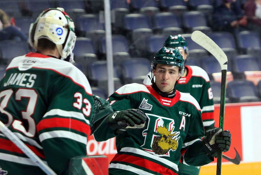 Nov. 6, 2020—Mooseheads’ Elliot Desnoyers jubliates with goaltender Brady James after scoring early in the first period against the Charlottetown Islanders.
ERIC WYNNE/Chronicle Herald