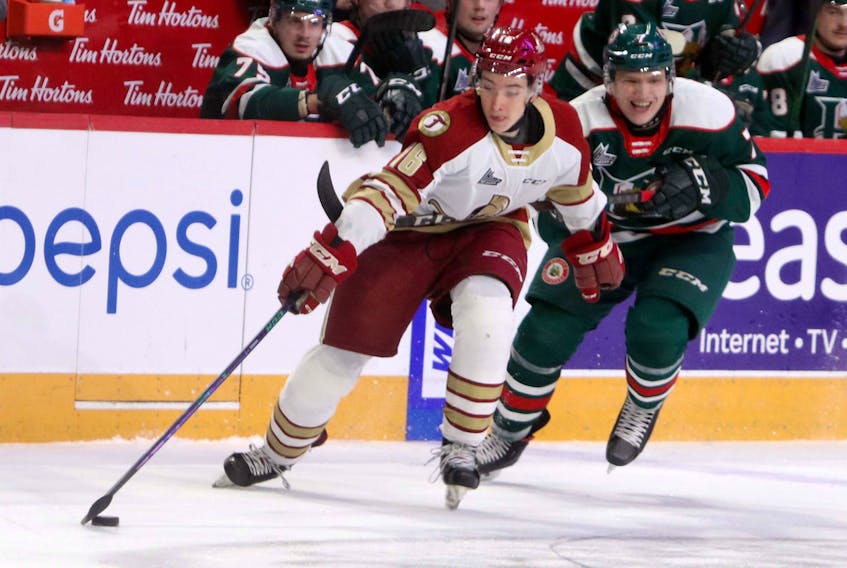 Nov. 20, 2020—Mooseheads’ Lucas Robison hooks his stick around Acadie-Bathurst Titan’s Dylan Andrews in the Halifax end during a scoring opportunity early in the first period. Robinson was assessed a hooking penalty and the Titan would eventually score a powerplay goal.
ERIC WYNNE/Chronicle Herald