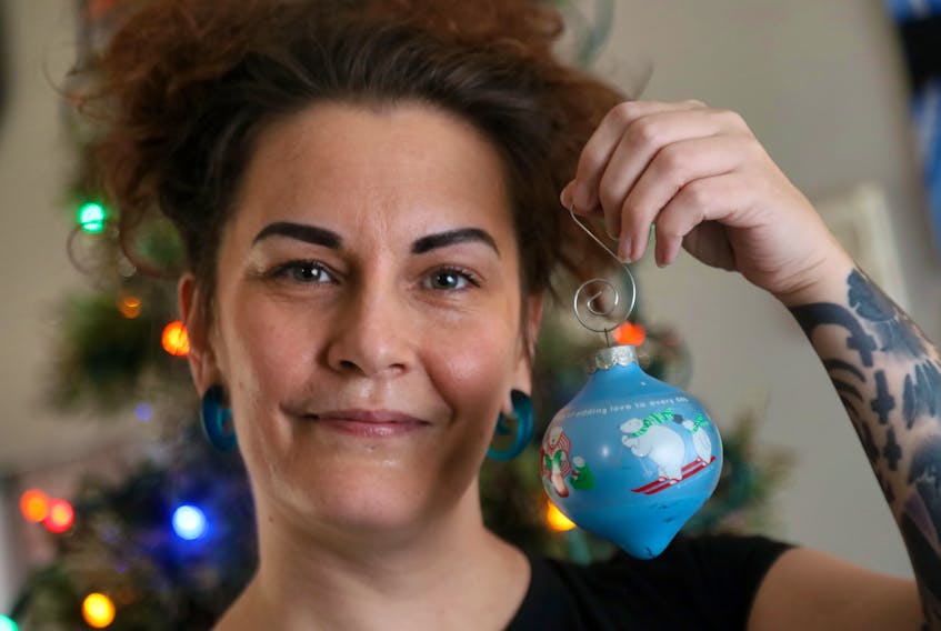 Dec. 14, 2020—Eliese MacKinnon holds up one of her favourite Christmas ornaments as she starts to decorate the tree at her mother’s Monday. MacKinnon says COVID has exacerbated her pre-existing mental health conditions.
ERIC WYNNE/Chronicle Herald
