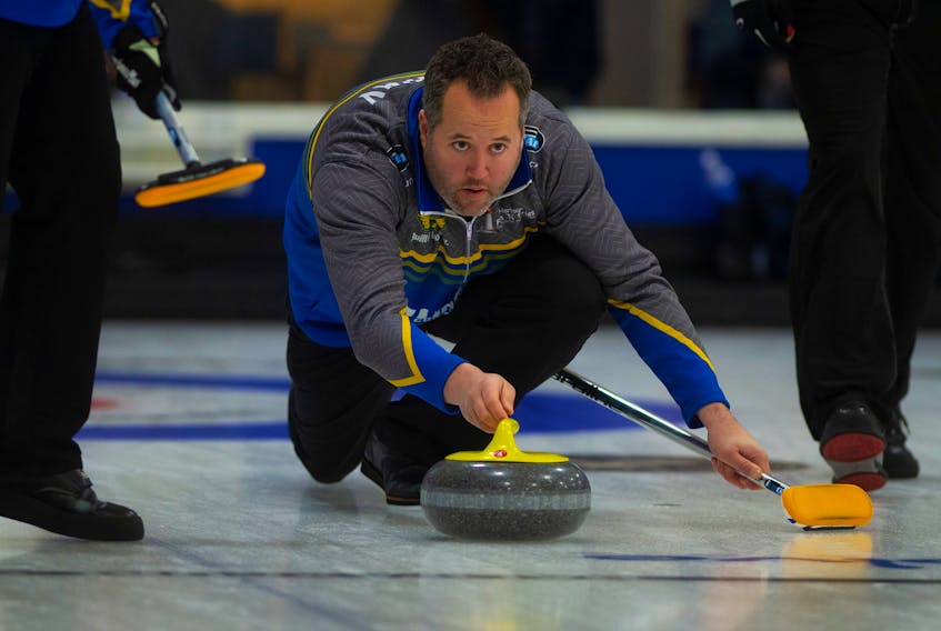 Skip Jamie Murphy throws his stone during an afternoon match against Kevin Ouellette's rink at the Stu Sells 1824 Halifax Classic at the Halifax Curling Club on Thursday. Ryan Taplin - The Chronicle Herald