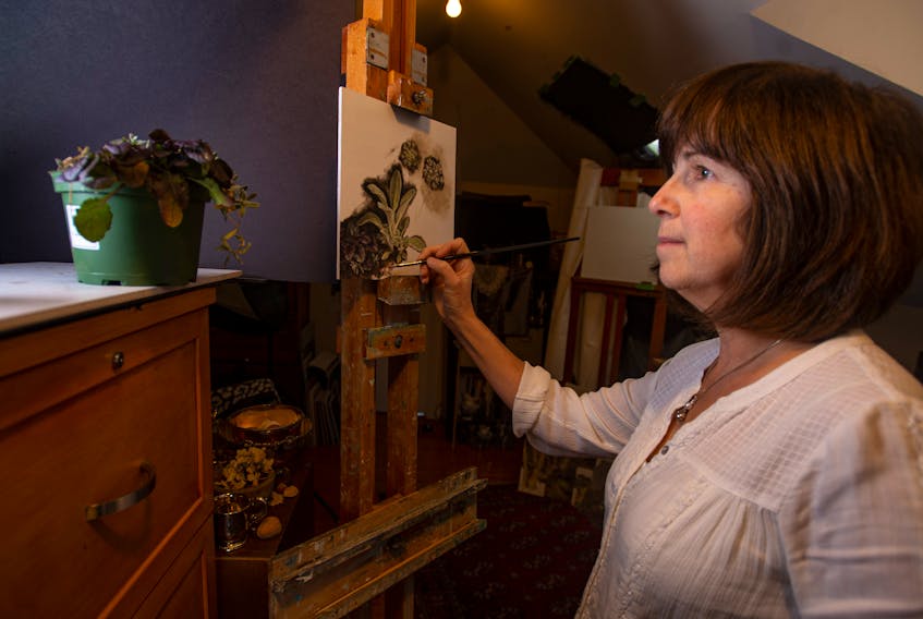 Artist Susan Paterson paints in her Dartmouth home studio on Friday, Nov, 22, 2019.