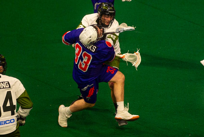 Rochester Knighthawks transition player Thomas Whitty levels Halifax Thunderbirds forward Austin Shanks just after Shanks scored a first half goal during Saturday night's National Lacrosse League game at the Scotiabank Centre.