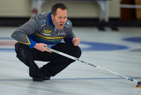 Skip Jamie Murphy throws his rock during the Deloitte Tankard men's curling final against Kendal Thompson  at the Dartmouth Curling Club on Sunday. Ryan Taplin - The Chronicle Herald