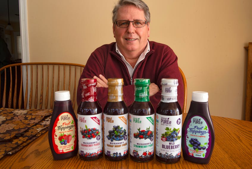 Tom Margeson, president and CEO of Healthy Berries Ltd., with some of his Superfruit Puree products at his Beaver Bank home on Monday, Feb. 1, 2021.