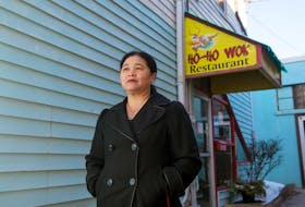 Sophie Luo poses for a photo outside her Ho-Ho Wok restaurant in downtown Truro on Monday, February 3, 2020. The restaurant is closing for a couple weeks after the owners went to Hong Kong for the Lunar New Year. They say they’re reacting to comments from the community about the coronavirus.