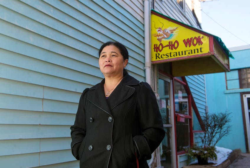 Sophie Luo poses for a photo outside her Ho-Ho Wok restaurant in downtown Truro on Monday, February 3, 2020. The restaurant is closing for a couple weeks after the owners went to Hong Kong for the Lunar New Year. They say they’re reacting to comments from the community about the coronavirus.