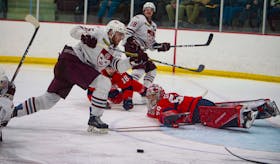 Saint Mary's Huskies forward Dawson Theede attempts to score on Acadia Axemen goalie Logan Flodell during Monday night's AUS men's hockey playoff game at the Dauphinee Centre. (Ryan Taplin/The Chronicle Herald)