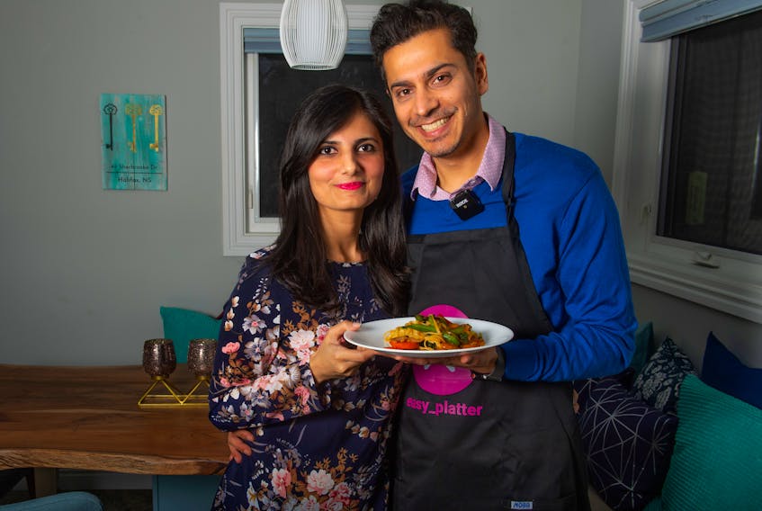 Poleen Kaur and her husband Mandhir Singh pose for a photo at their Halifax home on Tuesday, March 2, 2021. Singh's business, Easy Platter, connects customers with local personal chefs.