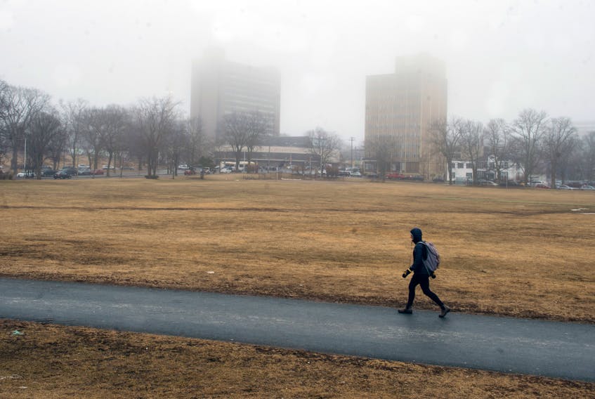 A pedestrian walks across the Halifax Common in early March, 2020