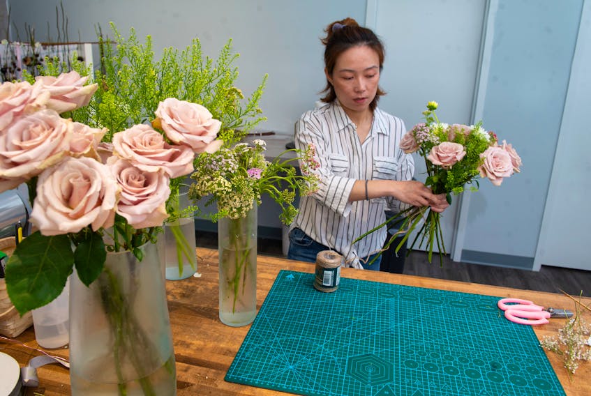 Sophie Li, owner of Bloom 24 Floristry, hopes Reopen City will bring in some new customers and encourage people to buy local. Li opened her Brunswick Street shop in February but had to close three weeks later due to the pandemic.