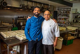 Ankur and Raj Gupta pose for a photo in the Scanway Catering kitchen on Wednesday, July 15, 2020.