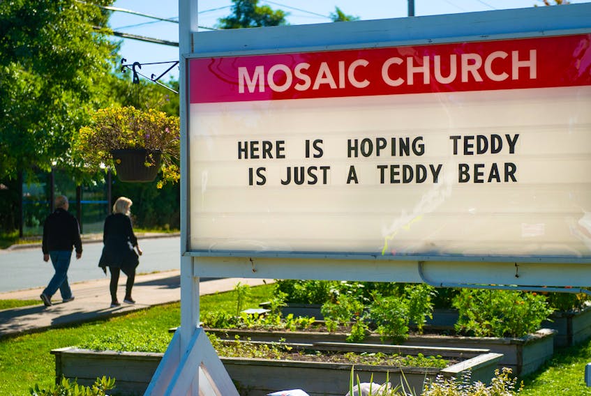 Pedestrians walk past the Mosaic Church sign in Fairview on Sunday, September 20, 2020. Teddy is expected to bring lots of wind and rain all day Tuesday and most of Wednesday. The storm is likely to make landfall on Eastern Shore early Wednesday.