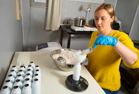 Alison Brown Dolmont, owner of Olga Designs makes some baby powder at her home-based business in Dartmouth. Some of Brown Dolmont's products will be featured in the Community Haul subscription box.