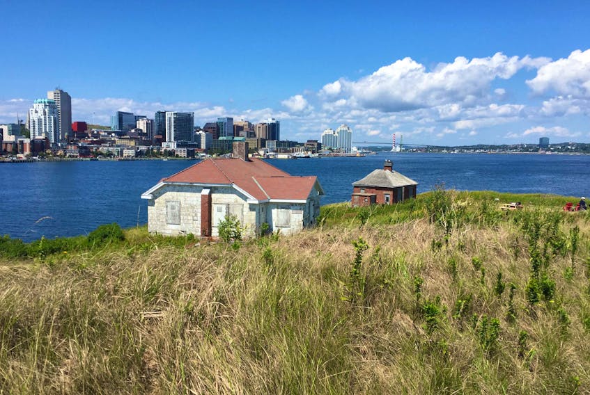 The Halifax Waterfront rises in the background of the historic Lighthouse Keeper's house on George's Island. The historically rich island will be open to the public on weekends starting Saturday, Aug. 8, 2020.