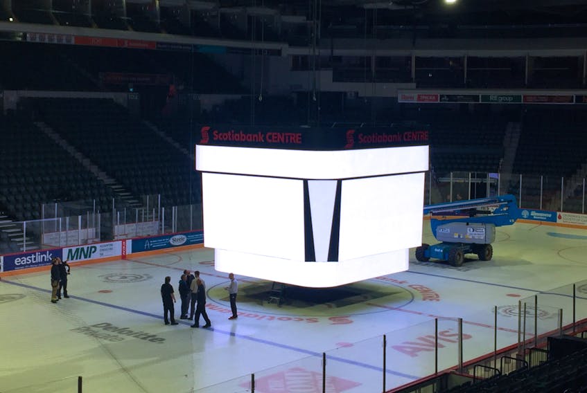 The score clock at Scotiabank Centre sits in the middle of the stadium on Thursday morning. A maintenance failure caused the score clock, with three people inside, to swing.