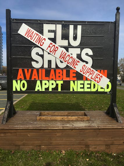 Last week, a sign at the Shoppers Drug Mart on Joseph Howe Drive advertising flu shots is covered with another sign stating that they were still waiting for supplies. TRACEY KING