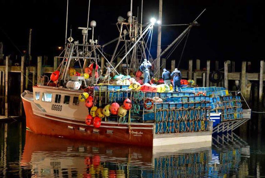 Lobster vessels loaded with traps during a previous November for the start of a lobster season in southwestern Nova Scotia. Trade disputes and tariffs were on the agenda of a lobster forum held in Yarmouth on Sept. 19.