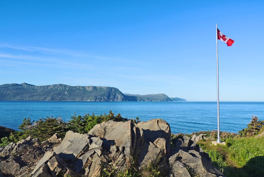 The Canadian flag stands at the entrance to Rocky Harbour.