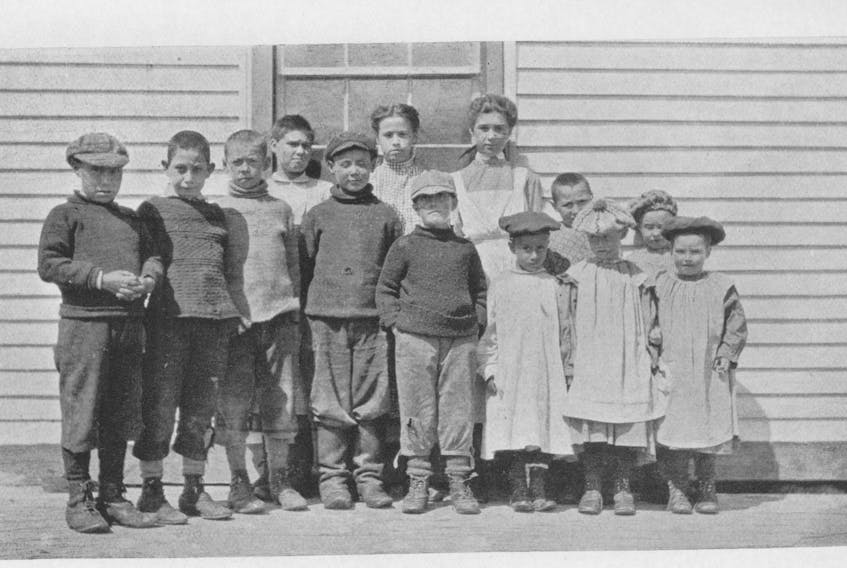 A group of orphan Labrador children gather for a photograph. Note especially the expressions on the faces of the boys – they are almost like determined, hardened men. The photo (c.1909) is reproduced from “Labrador” by W.G. Gosling, published in 1910.