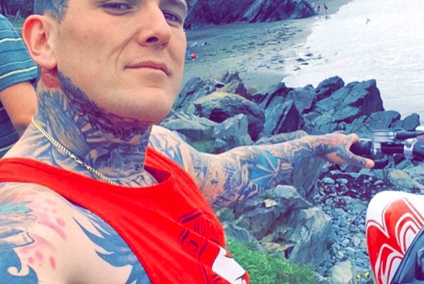 Mitchell White said he was denied entry into The Martini Bar in St. John's Saturday night because he has visible neck tattoos.