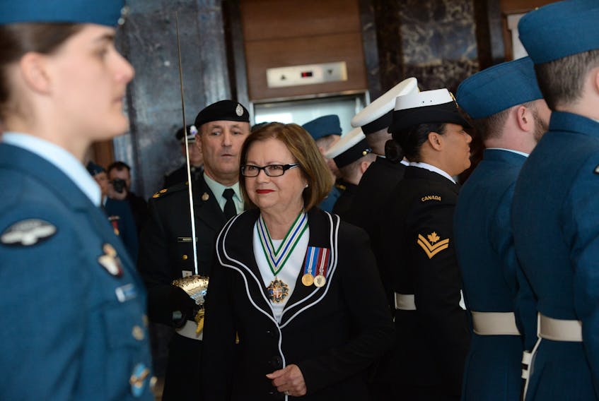 Lt.-Gov. Judy Foote inspects the Canadian Forces honour guard prior to entering the House of Assembly to read the speech from the throne Thursday.