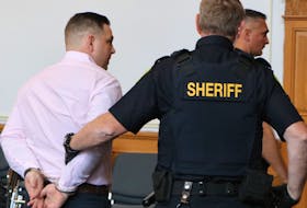 Craig Pope looks at family members as he is escorted away in handcuffs following his sentencing Friday in Newfoundland and Labrador Supreme Court.