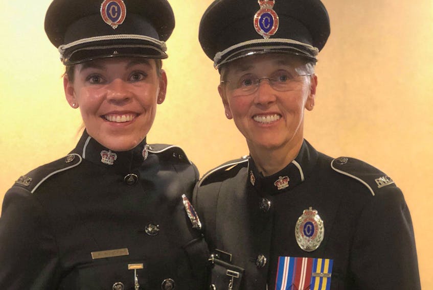 Veteran RNC Const. Georgina Short (right) and recent graduate Const. Jessica Woodfine have a long history together, although Short knew nothing about it until recently.