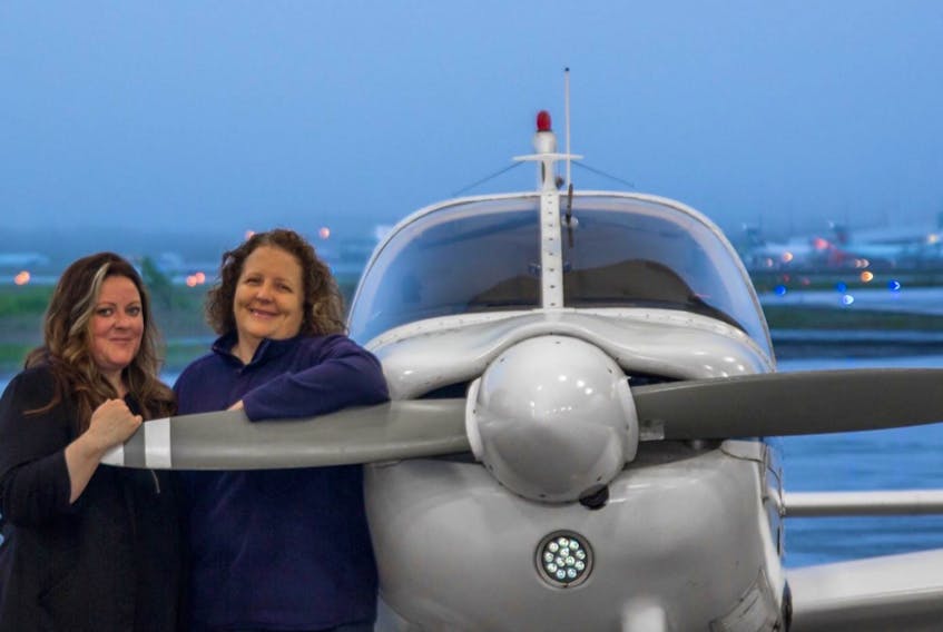 Sheri Ford (left) and Minette LeDrew are experienced pilots — two of not many in the province — who love the adventure of taking to the open skies.