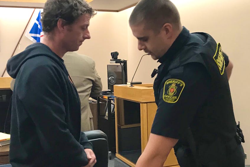 Travis Hickey, 31, is taken into custody after he was sentenced to four months in jail for assaulting a woman and causing her bodily harm as well as threatening her life.