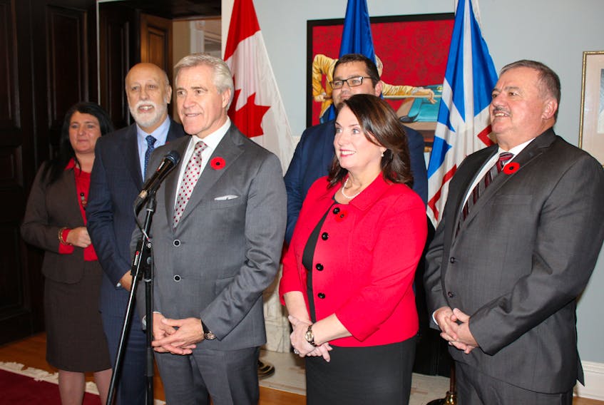 (From left) Minister Responsible for the Status of Women Carol Anne Haley, Minister of Education and Early Childhood Development Al Hawkins, Premier Dwight Ball, Minister of Advanced Education, Skills, and Labour  Bernard Davis, Minister of Natural Resources Siobhan Coady, and Minister of Municipal Affairs and Environment Graham Letto pose for reporters after Thursday’s cabinet shuffle.